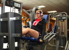 woman in gym doing leg press